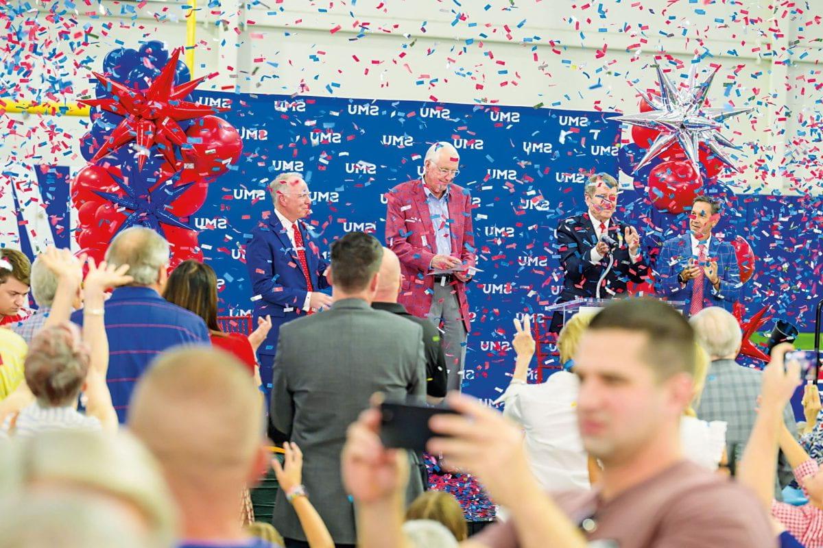 Celebration of SMU's joining of the Atlantic Coast Conference, confetti is flying in the air while fans of the SMU Mustangs celebrate and cheer